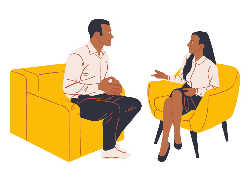 man and woman on a yellow couch talking about the fear of spending money 