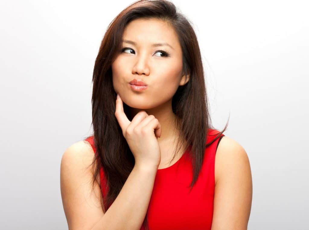 woman red shirt pondering