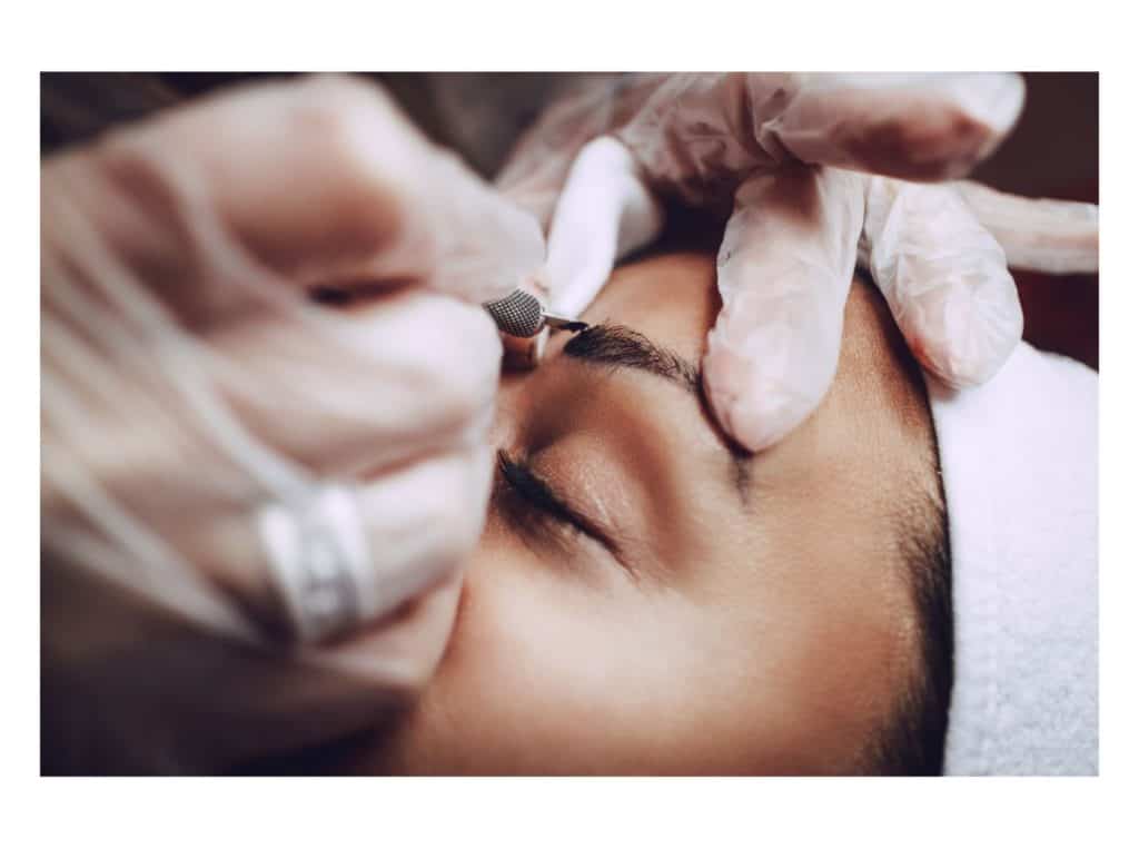 person microblading representing how to start a microblading business